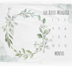 a calendar with a wreath of leaves on it