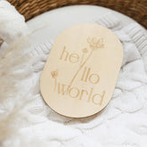 a white teddy bear laying on a white blanket