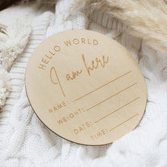 a personalized wooden ornament on a white sweater