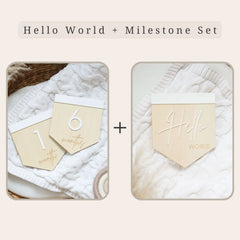 a couple of wooden tags sitting on top of a white blanket