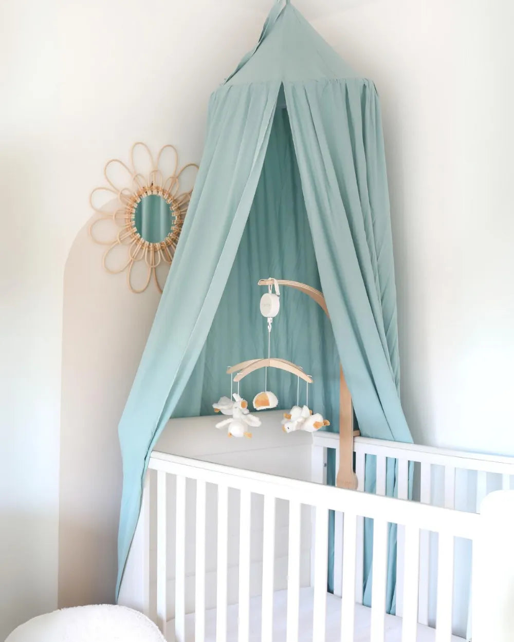 a baby's room with a canopy over the crib