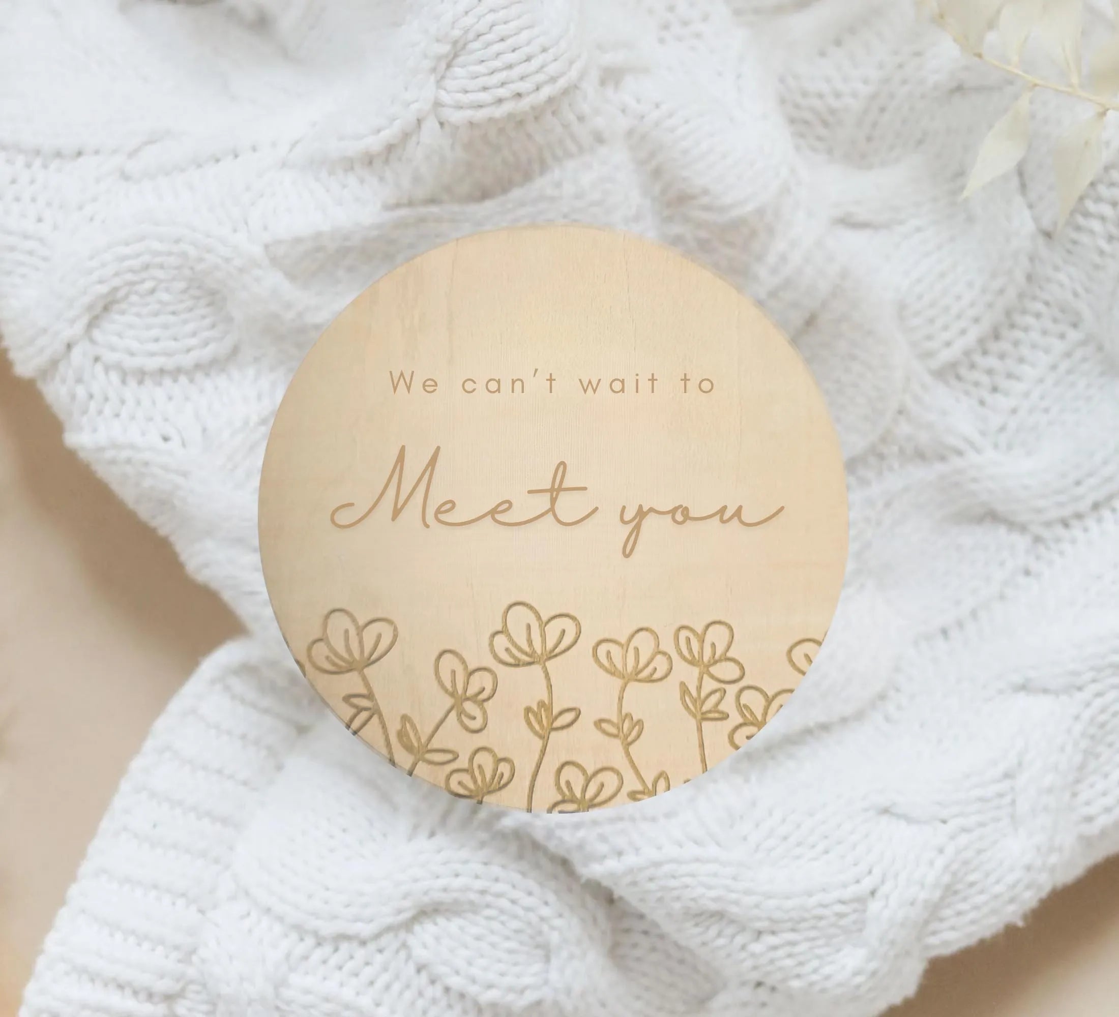 a wooden brooch with a message on it