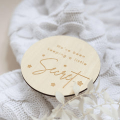 a wooden coaster with a name on it