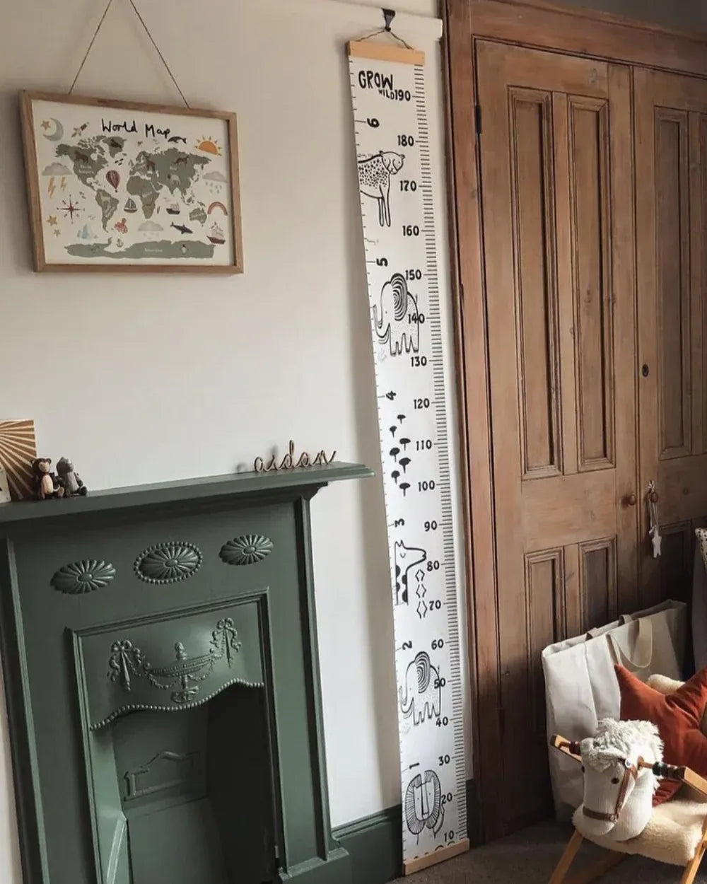 a living room with a fireplace and a wall hanging