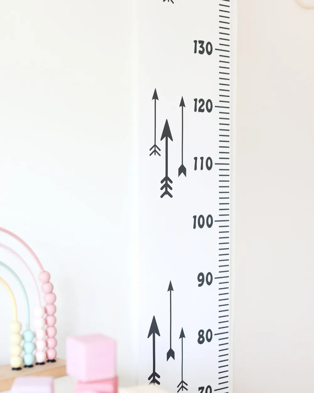 a child's growth chart is shown next to a toy