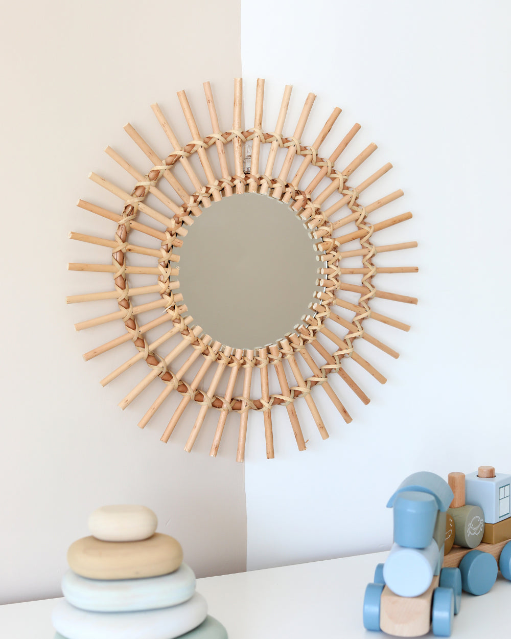 a mirror that is on the wall above a table