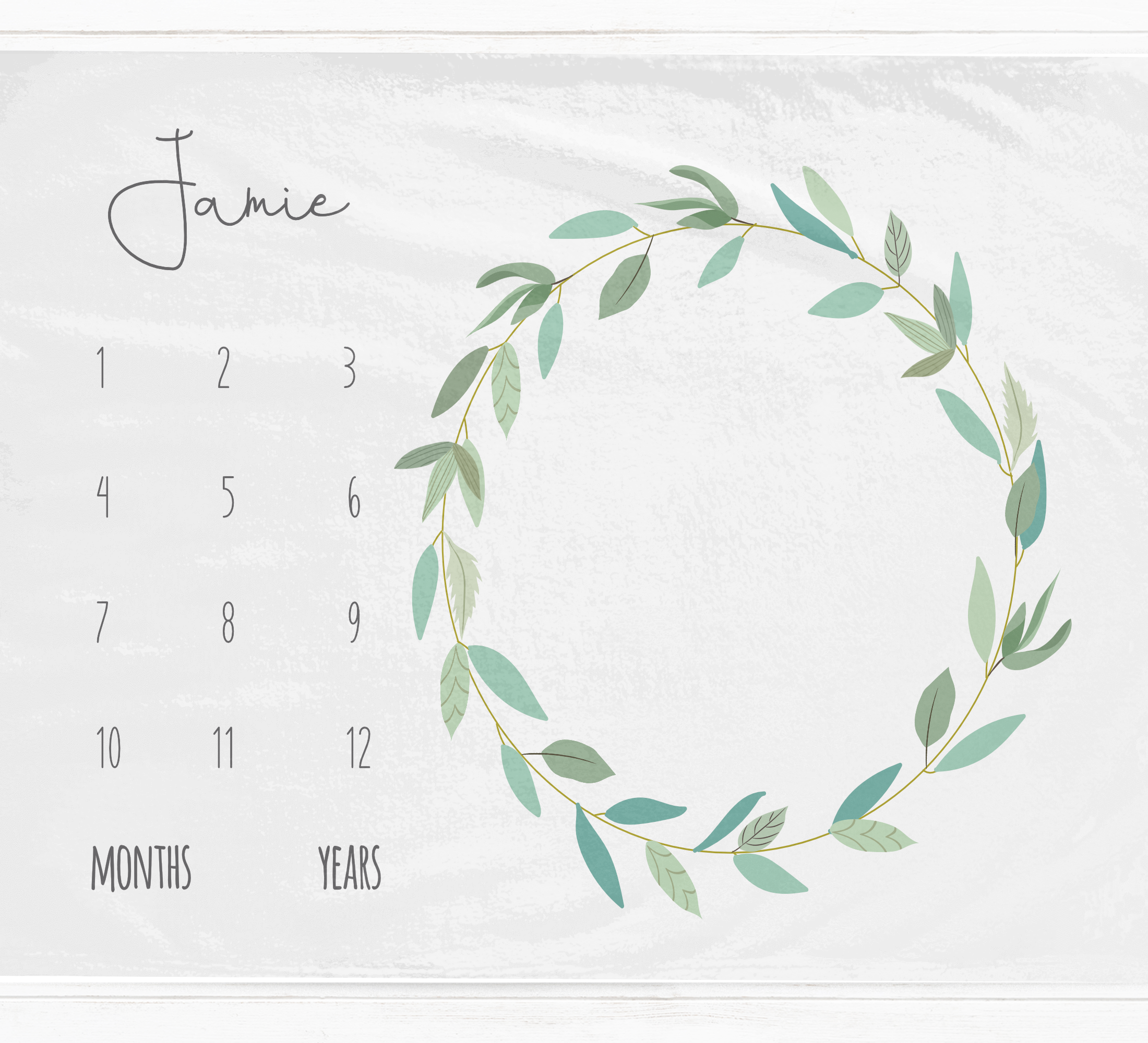 a calendar with a wreath of leaves on it