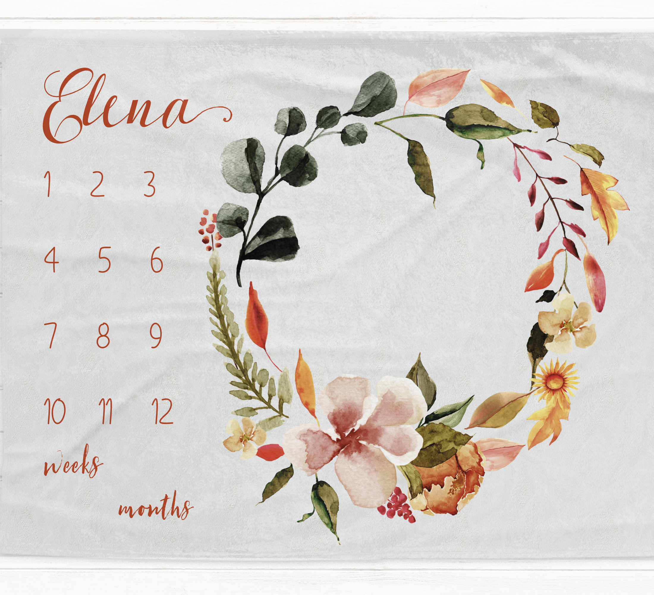 a calendar with a floral wreath on it