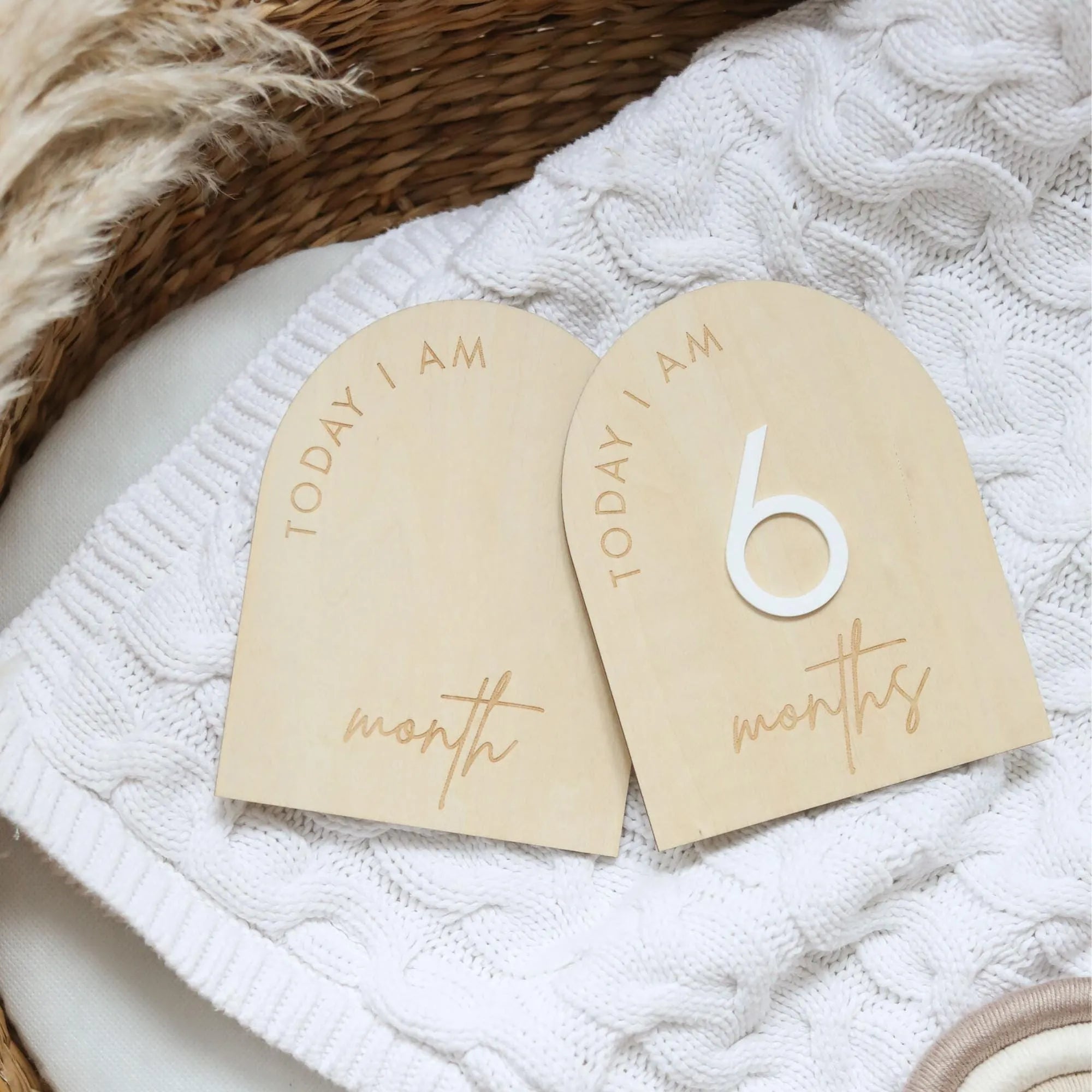 a couple of wooden tags sitting on top of a table