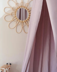 a room with a bed and a mirror on the wall