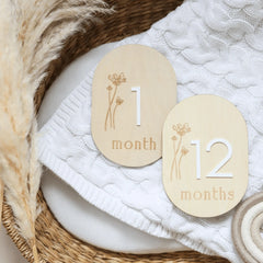 a basket with two wooden tags on it