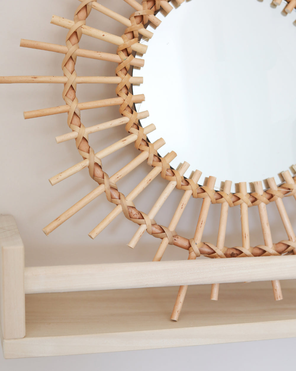 a mirror that is sitting on a shelf