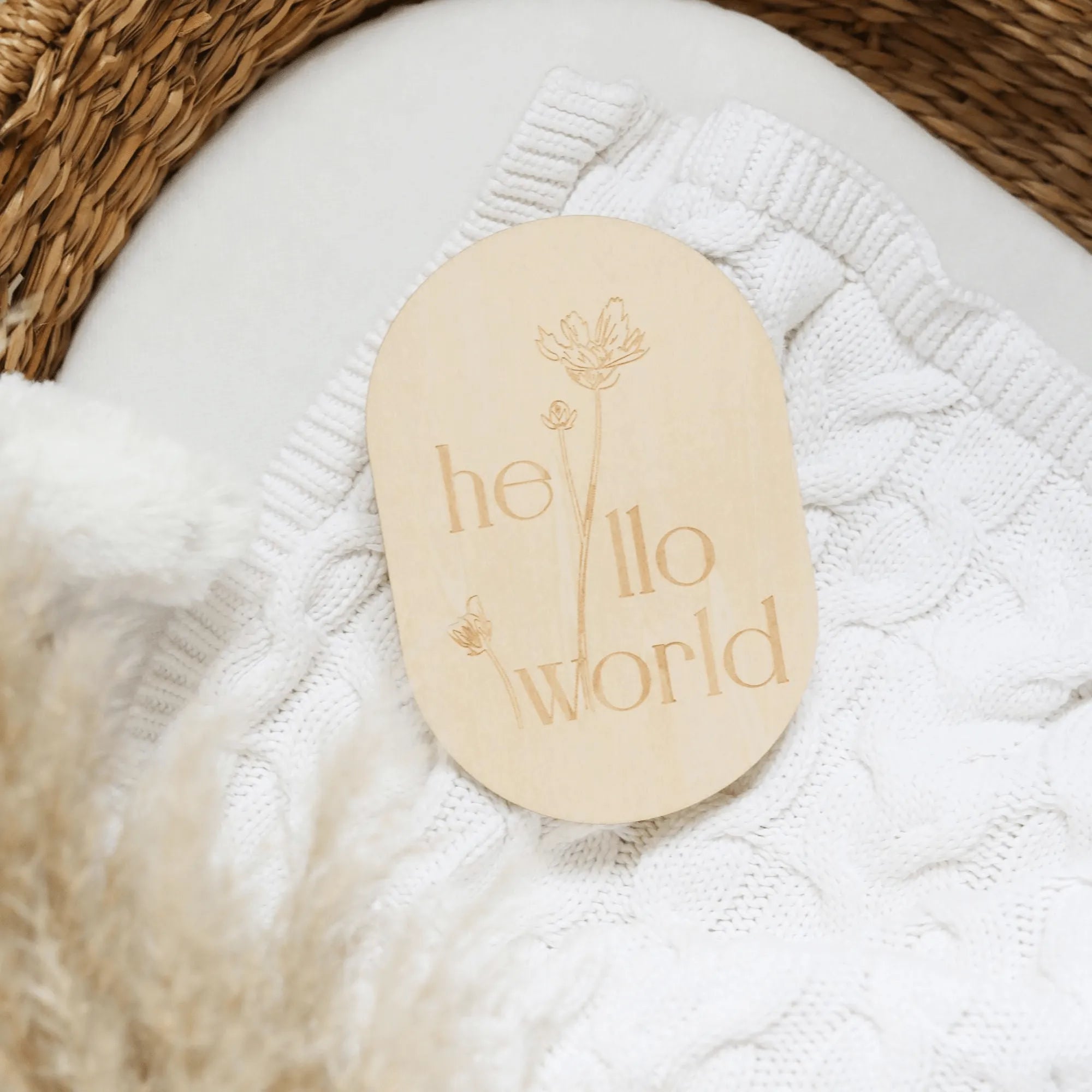 a close up of a wooden tag on a blanket